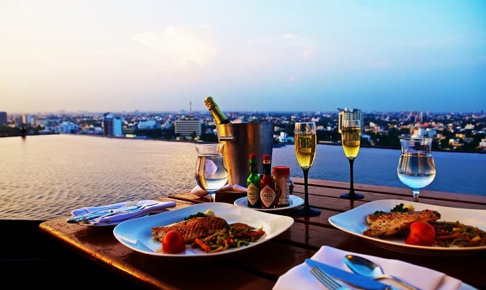 dinner at roof top hotel with swimming poodl - honeymoon tour in delhi